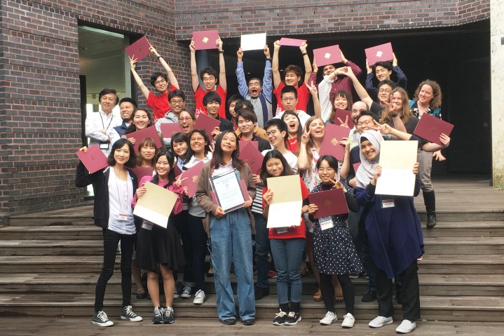 Students holding their certificates