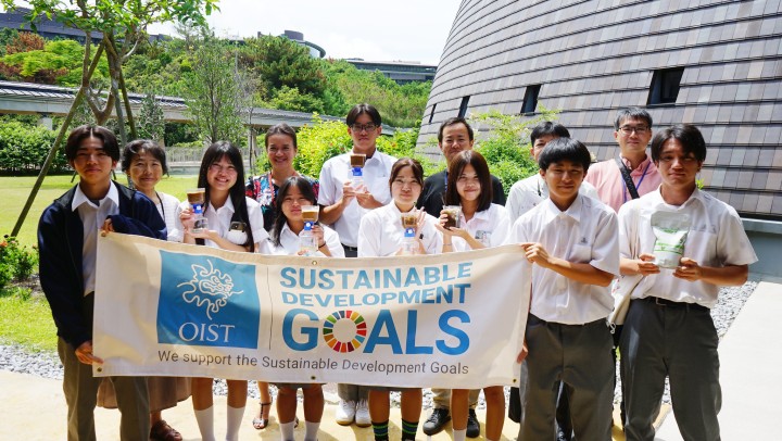 High School Students holding SDGs banner