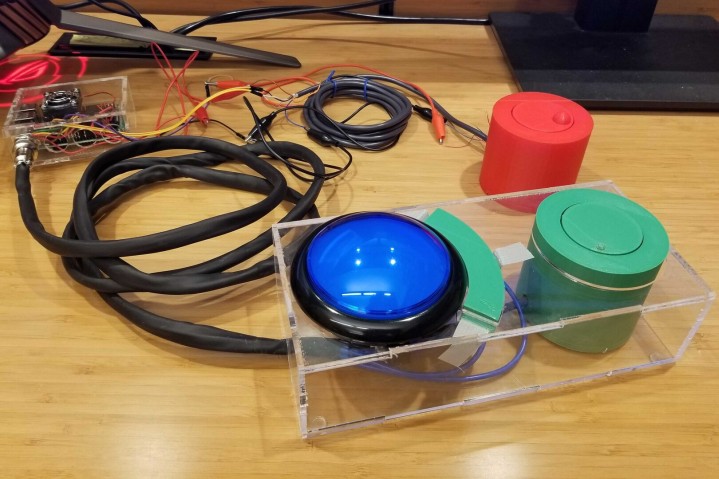 cylinders in red and green, blue round material and black wires