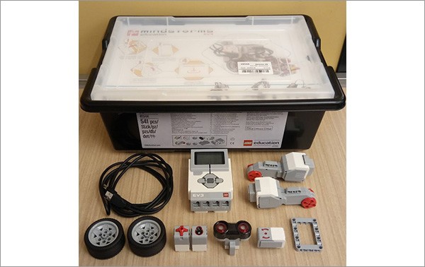 A big plastic box and small plastic kits and a wire