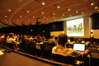 researchers in lecture hall at the retreat