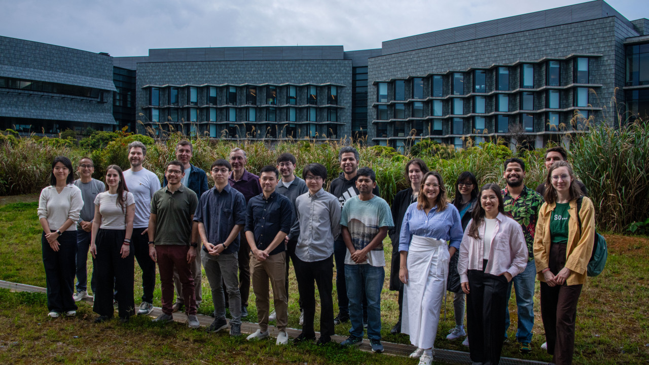 Participants from the Mirror Lab Symposium: Frontiers in Recent Human Evolution gather for a group photo outside of Lab 5.