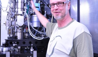 Lars Goran Ofverstedt in front of a machine