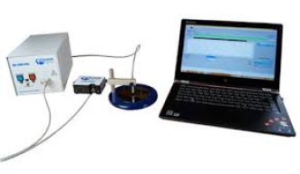 small unit, table top with control laptop PC, optical fiber head and sample mounting for wafers. Ocean optics spectrometer box.
