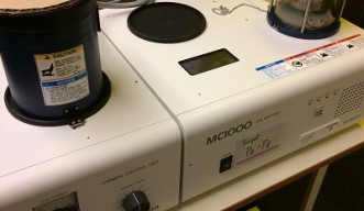 sputtering device from Hitachi, tabletop with timer controls and small sample chamber