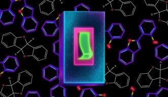 A light switch sits in front of a background composed of two different chemicals, one fluorescent and one not.