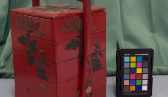 A red bento box belonging to the Yomitan Museum