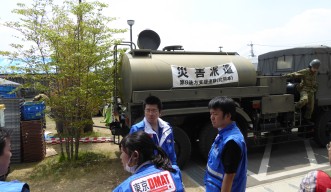 The Japanese self-defense force (pictured at the back) also participated in the relief efforts
