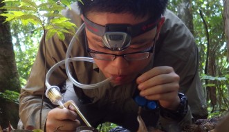 Cong Liu, OIST Ph.D. student, in the field