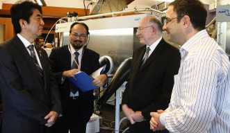 Professor Sowwan discusses his research with Prime Minister Abe