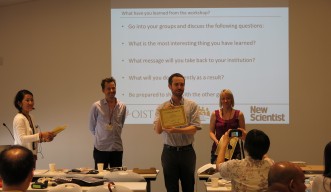 A participant receives his certificate at the ISCW Summer School 2015