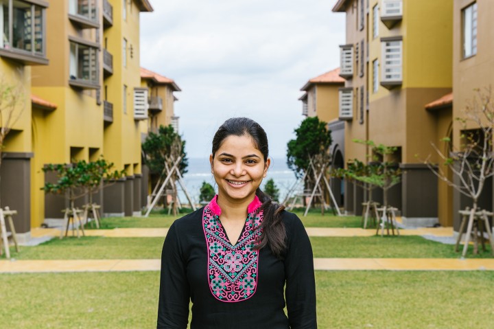 woman standing in front of the OIST residence buildings