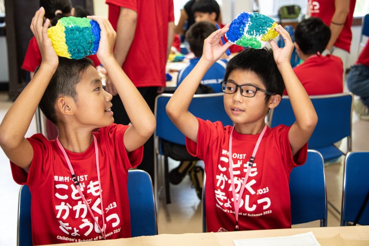 Children making their own brain models and showing them off to each other