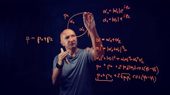 Artur Ekert writing on glass