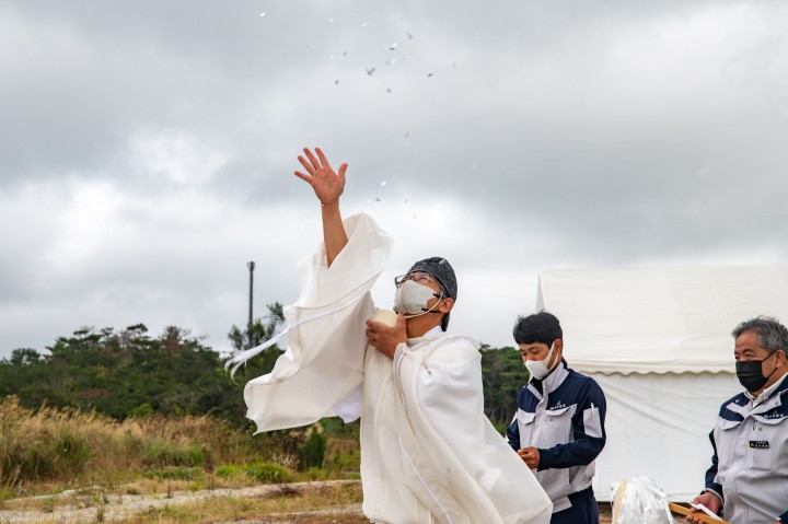A Shinto priest performs purification rights