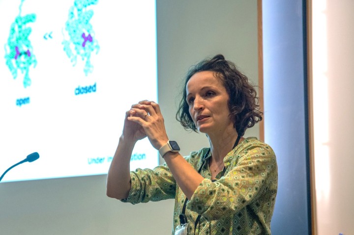 women looking to the left with hands cupped