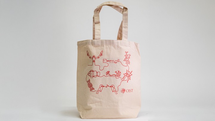 white tote bag with OIST logo and design