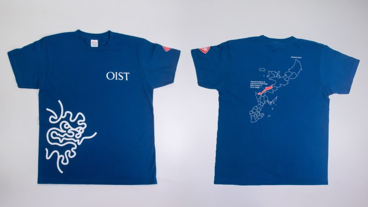 blue T-shirt with OIST logo on the front and a map of Okinawa on the back