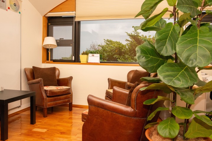 Arm chairs and a table in a room