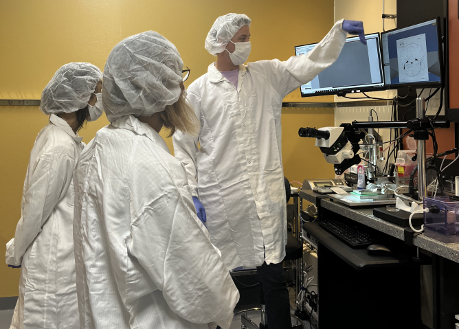 Hugo explaining how mouse brain surgery is done