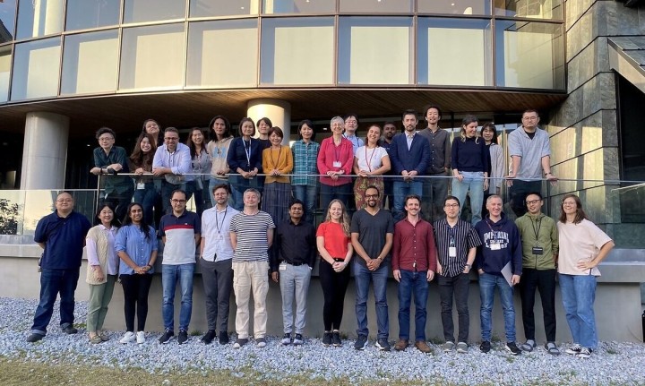 A group of people in front of a building