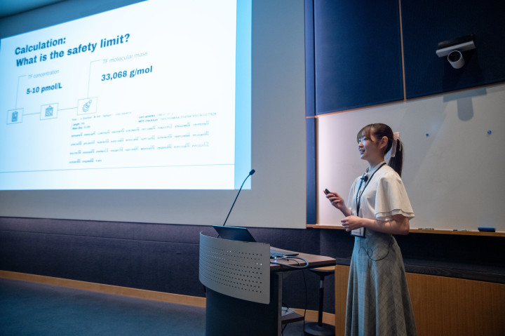 A Keio student sharing her research at the Flash Talks event.