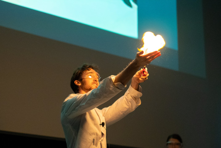 Jack igniting propane-filled bubbles in his hand, creating a fireball.
