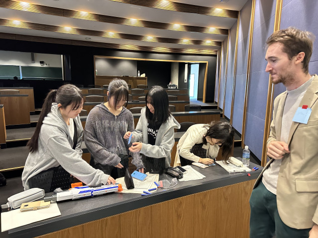 Students working on an experimental challenge supervised by Jack.