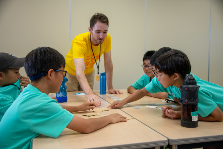Jack playing a guessing game with students.