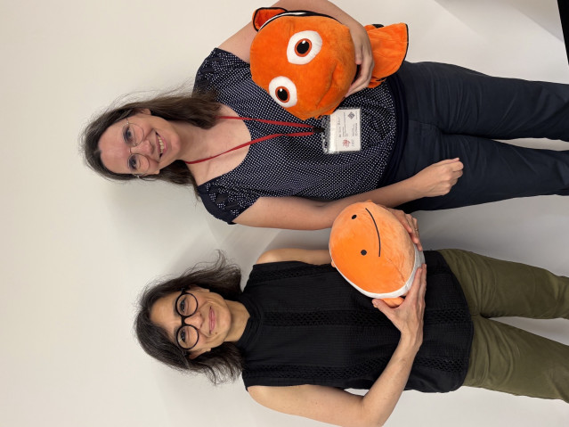 two ladies with Nemo fish doll