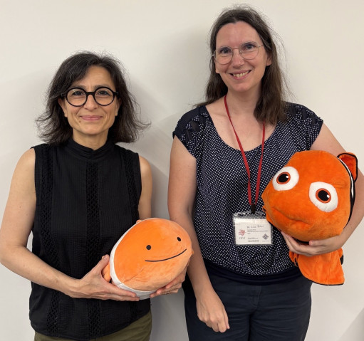 two ladies with Nemo doll