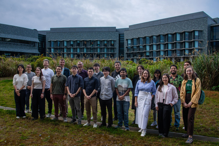 Participants from the Mirror Lab Symposium: Frontiers in Recent Human Evolution gather for a group photo outside of Lab 5.