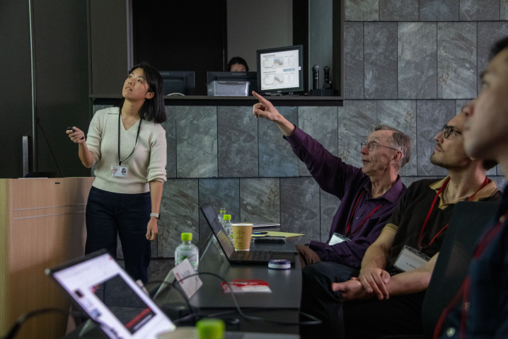 Dr. Shin-Yu Lee delivers a talk during the symposium, presenting ongoing research to attendees gathered in the seminar room.