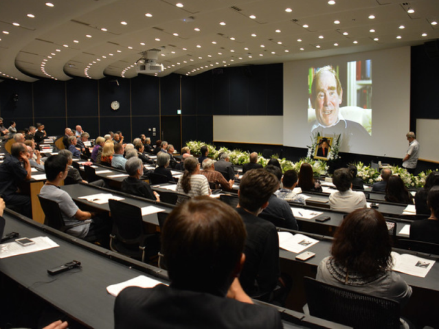 People seated in a lecture hall