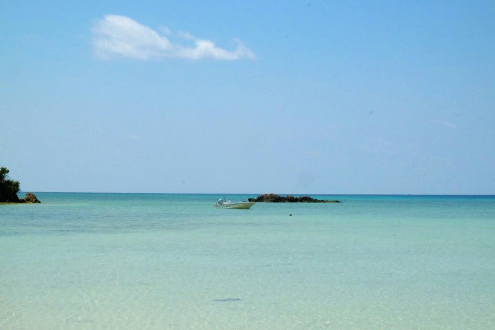 Fishing boat in shallow tropical waters