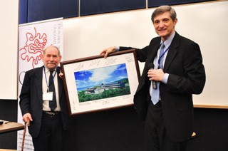 Dr. Baughman presents Dr. Brenner with OIST photo signed by BOG members