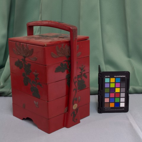 A red bento box belonging to the Yomitan Museum