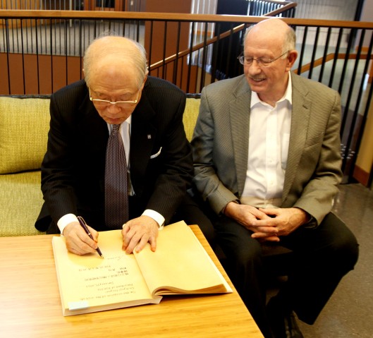 Ryōji Noyori, Nobel Laureate and President of RIKEN, signs the Golden Book