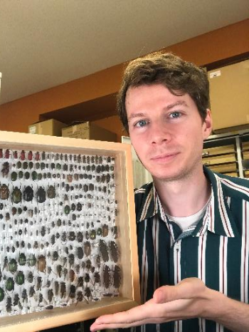 A man holding a specimen