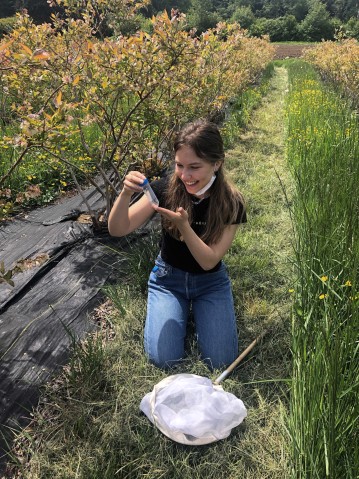 Yulia Shcherbakova looking at insects