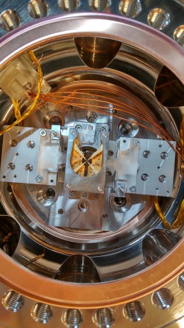 Header image for the press release "OIST spin-out startup Qubitcore advances toward social implementation of Japan-made ion trap quantum computers"