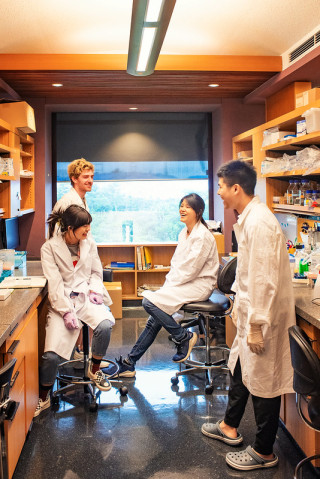 Young scientists wearing white coat in a lab