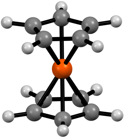 A molecular structure of ferrocene, with five carbon atoms in a pentagon above and below an iron (depicted as a red circle with a + sign in it).