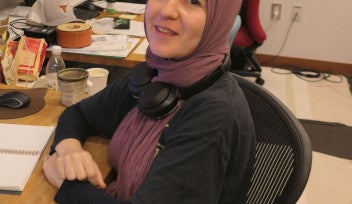 A woman sitting in an office