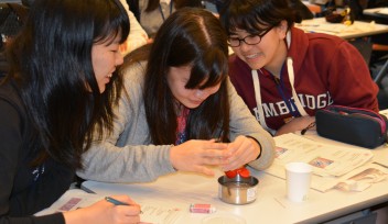 High school students from Okinawa experimenting with surface tension