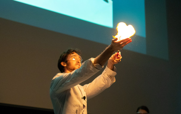 Jack igniting propane-filled bubbles in his hand, creating a fireball.