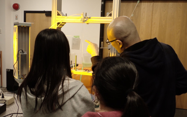 Soda showing students a soap film.