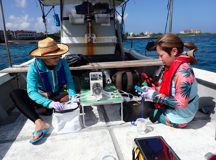 Scientists examines eDNA on a boat