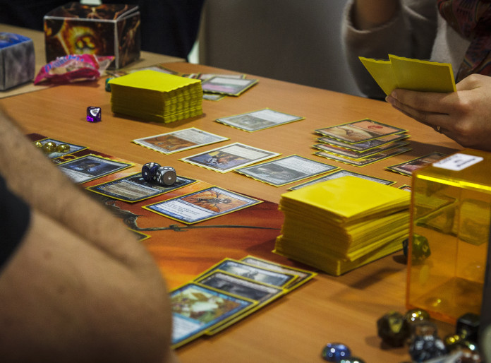 Two people playing a game of Magic the Gathering
